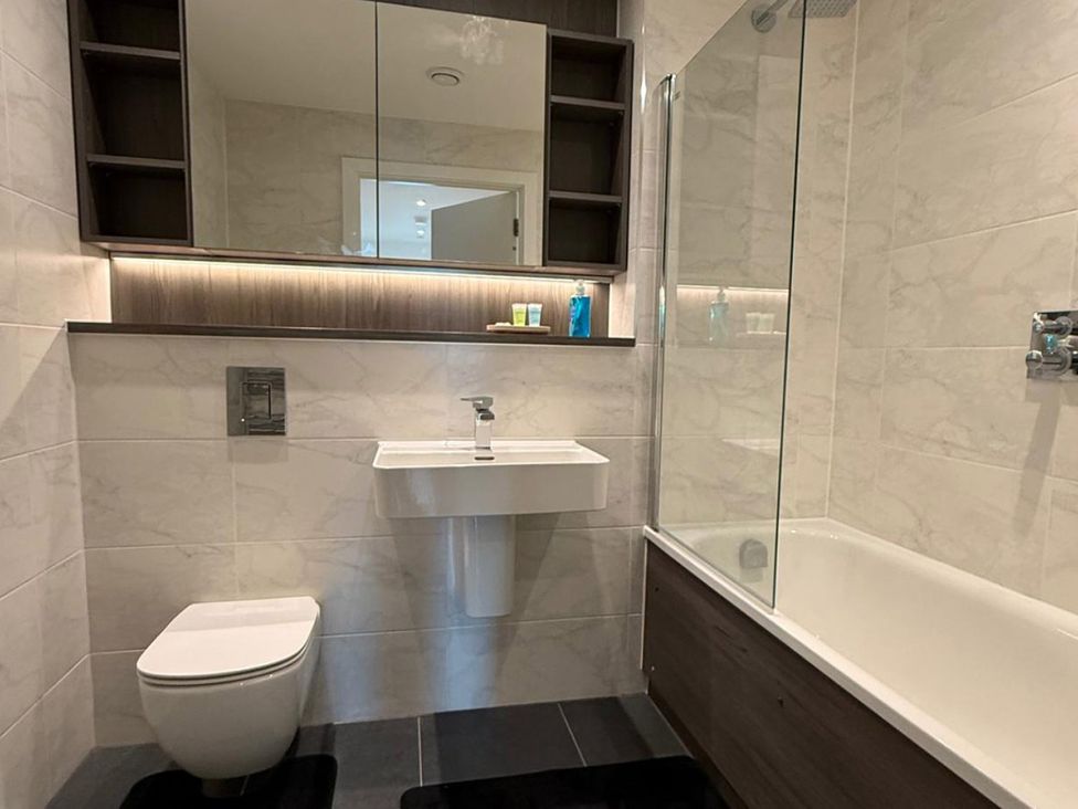 A bathroom with a sink and a bathtub at 3 Bed Apartment, sleeping 6 with Wifi, Manchester