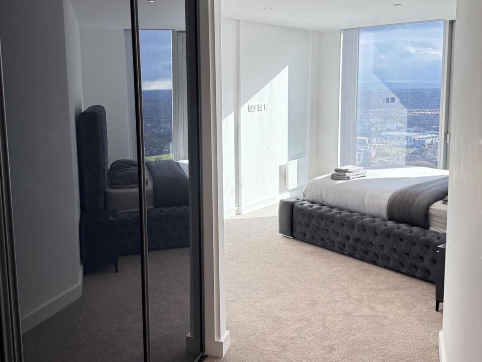 A bedroom with a bed and window at 3 Bed Apartment, sleeping 6 with Wifi in Manchester