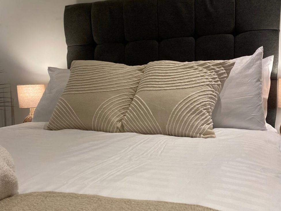A bedroom with pillows on a bed at Central Apartment with Free Parking, Terrace and Gym in Manchester