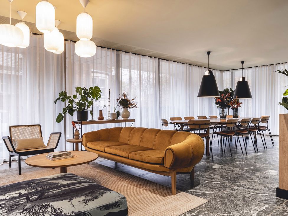 A living room with a sofa and dining area at Central Apartment with Free Parking, Terrace and Gym in Manchester