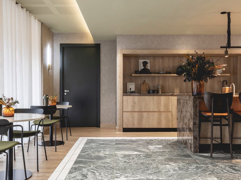 A kitchen with table and chairs at Central Apartment with Free Parking, Terrace and Gym, Manchester