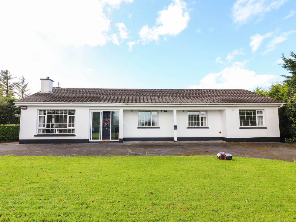A front view of a house with a garden at Cross Beg Kilmihil, County Clare