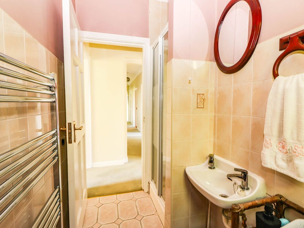 A bathroom with a sink and towel rail at Cross Beg in Kilmihil, County Clare