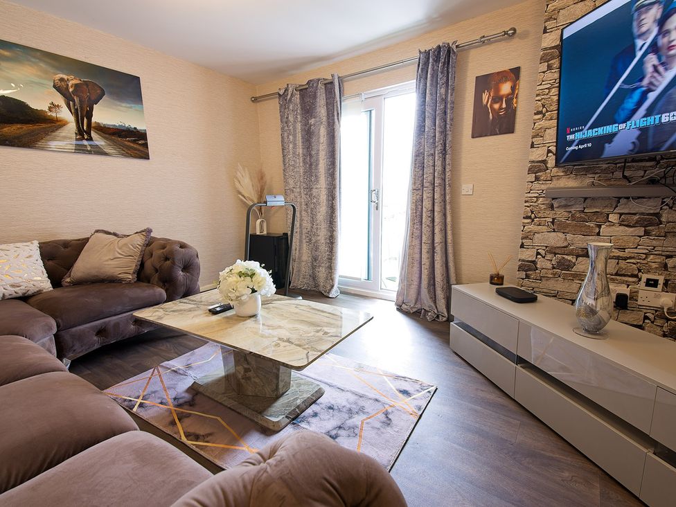 A living room with a sofa and coffee table at 2 Bedroom Apartment in Manchester