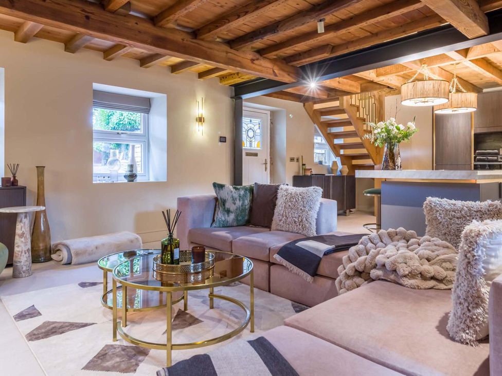 A living room with a sofa and coffee table at Heaven Lea Cottage