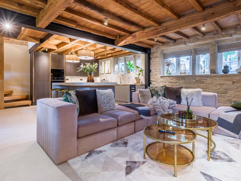 A living room with a sofa and coffee table at Heaven Lea Cottage