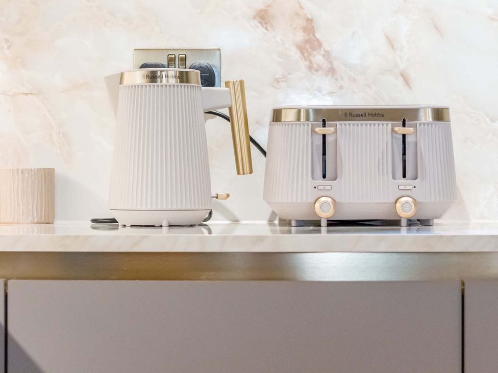 A kettle and toaster on a countertop at Heaven Lea Cottage