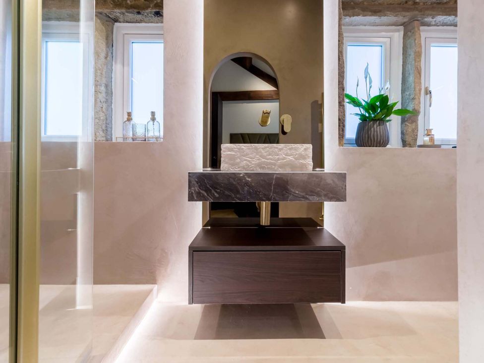 A bathroom with a sink and mirror at Heaven Lea Cottage