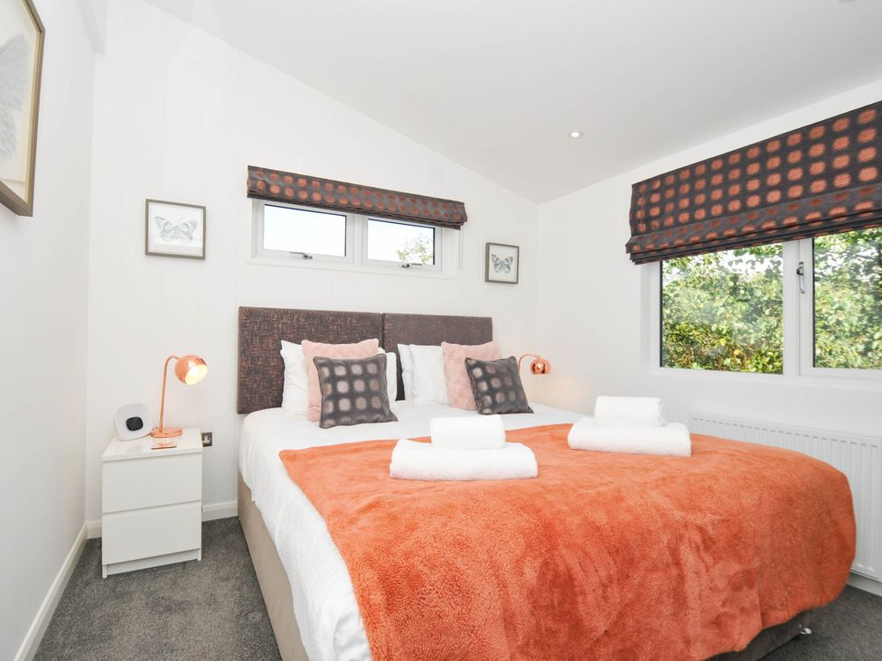 A bedroom with a bed and window at 22 Meadow Retreat in Dobwalls