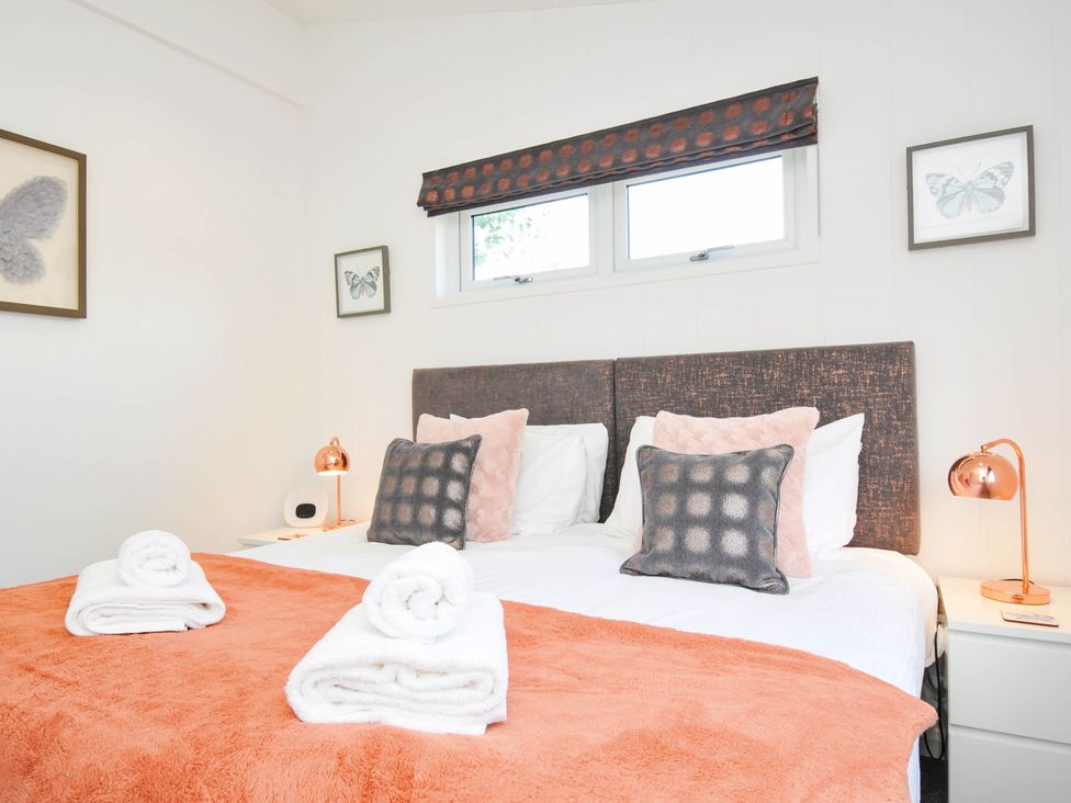 A bedroom with a bed and pillows at 22 Meadow Retreat in Dobwalls