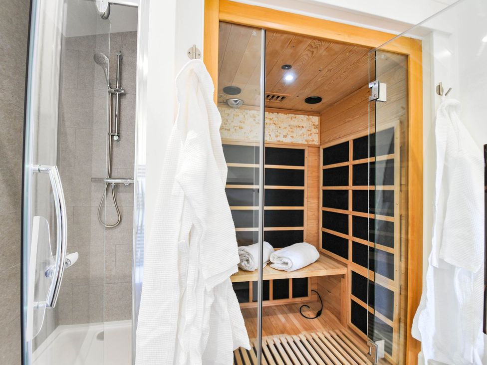 A bathroom with a shower and sauna at 22 Meadow Retreat in Dobwalls