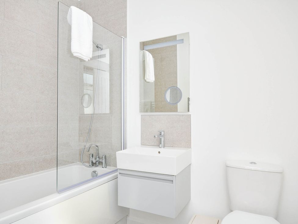 A bathroom with a bathtub, sink, and toilet at 22 Meadow Retreat in Dobwalls
