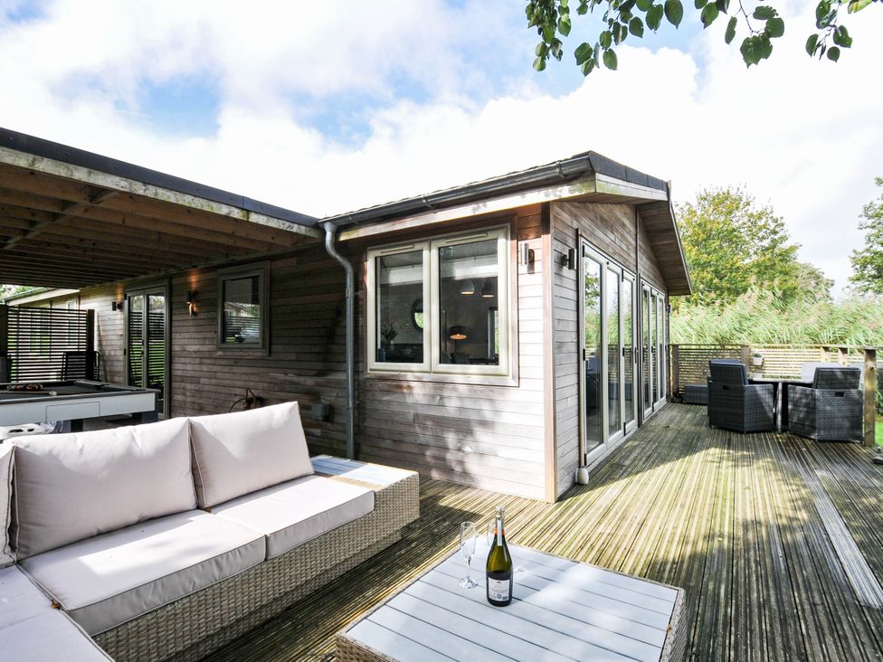 An outdoor area with a sofa and table at 22 Meadow Retreat in Dobwalls