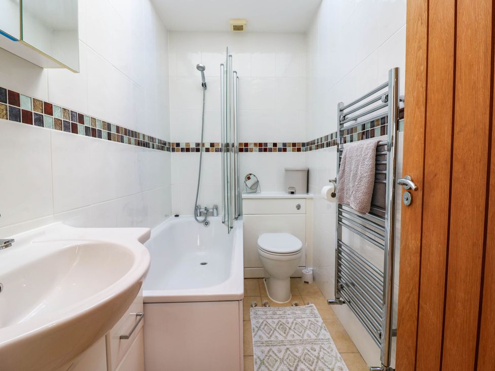 A bathroom with a bathtub and shower at Rosie Lodge in Hastings