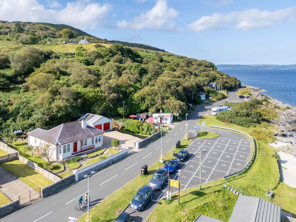 An outdoor view of a house and parking area at Fereneze, Lochranza, Isle Of Arran