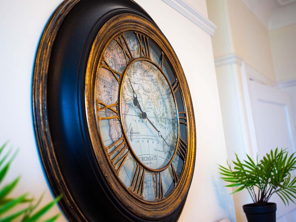 A wall clock with a map design at Fereneze, Lochranza, Isle Of Arran