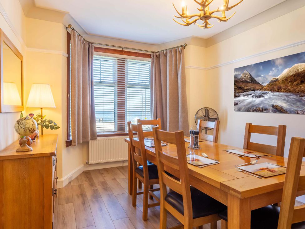 A dining room with a table and chairs at Fereneze, Lochranza, Isle Of Arran
