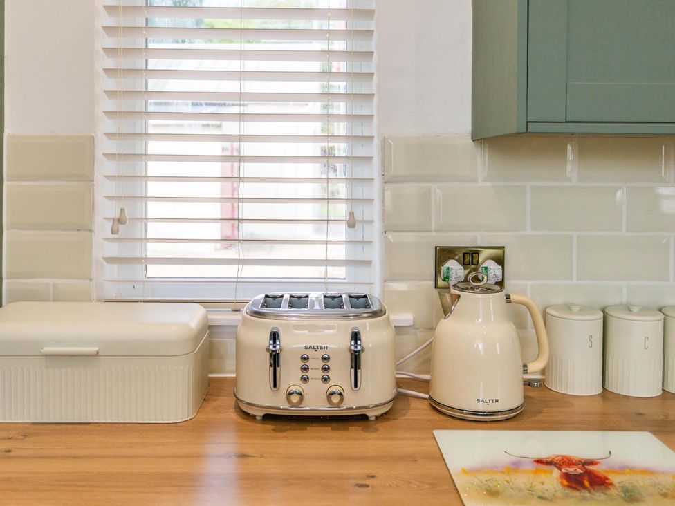 A kitchen with a toaster and kettle at Fereneze, Lochranza, Isle Of Arran