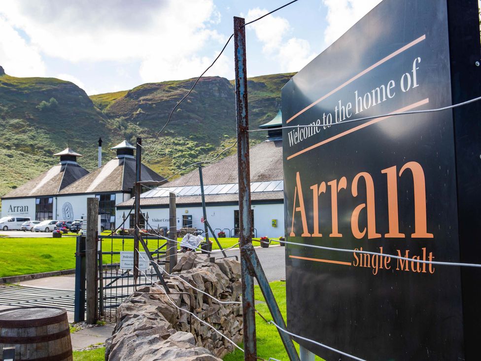 A distillery with a visitor center and barrels at Fereneze in Lochranza, Isle Of Arran
