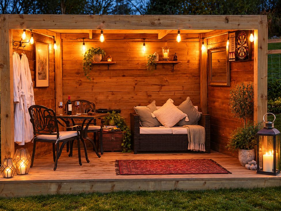 An outdoor shelter with seating and decor at Oak Hut Bishops Castle