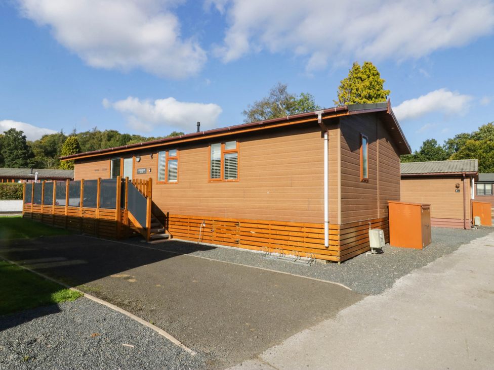 A wooden cabin with a deck and steps at Thirlmere Scar Troutbeck Bridge
