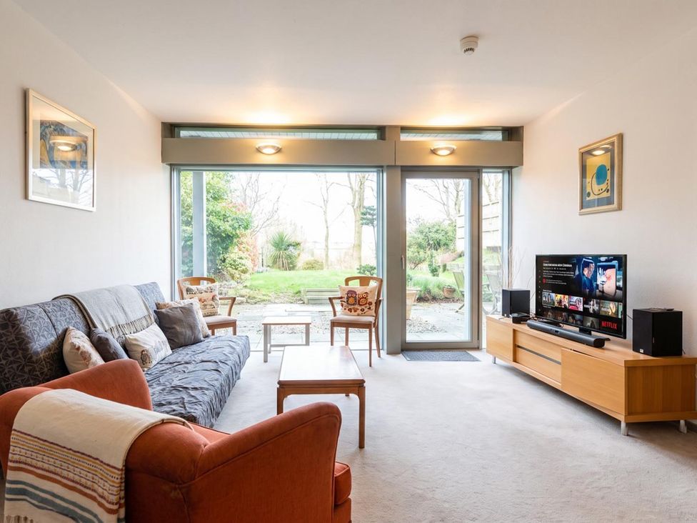 A living room with a sofa and coffee table at Two Hoots Littleworth