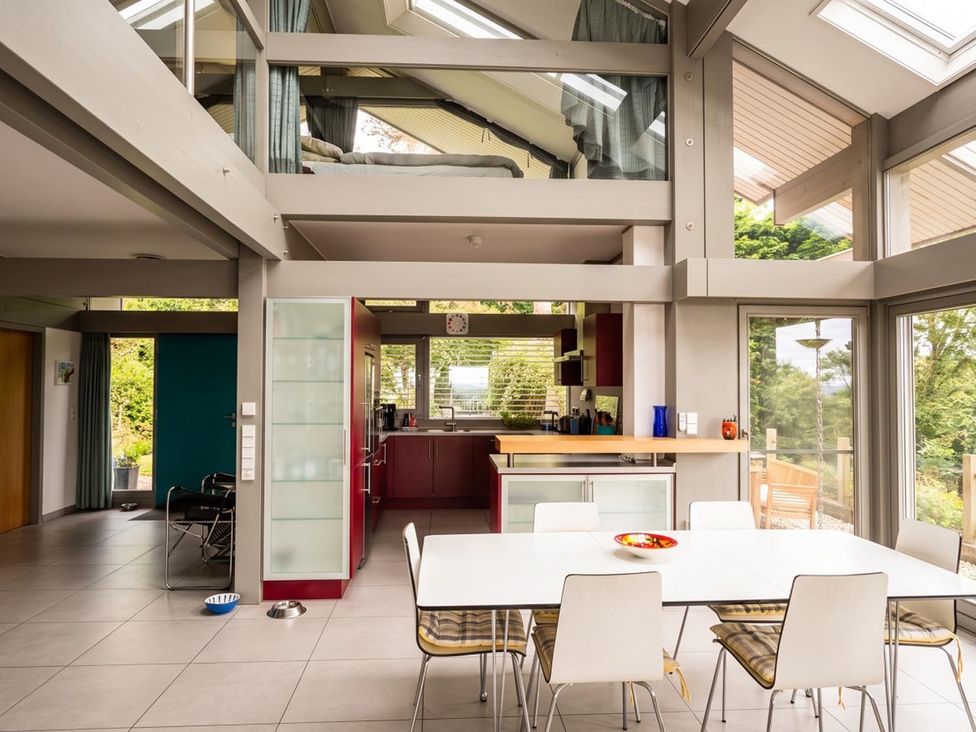 A kitchen with a dining table and chairs at Two Hoots Littleworth