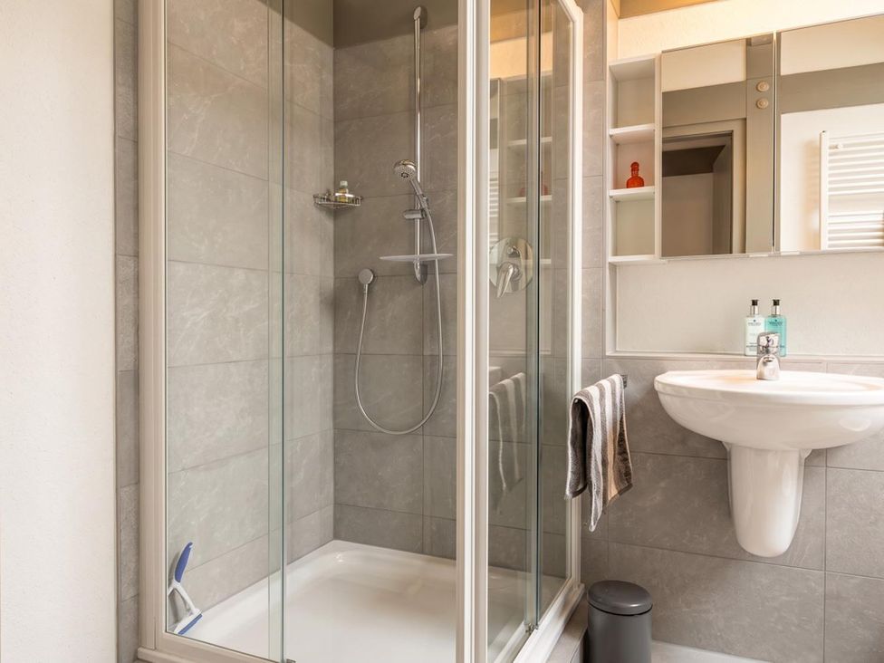 A bathroom with a shower and sink at Two Hoots Littleworth