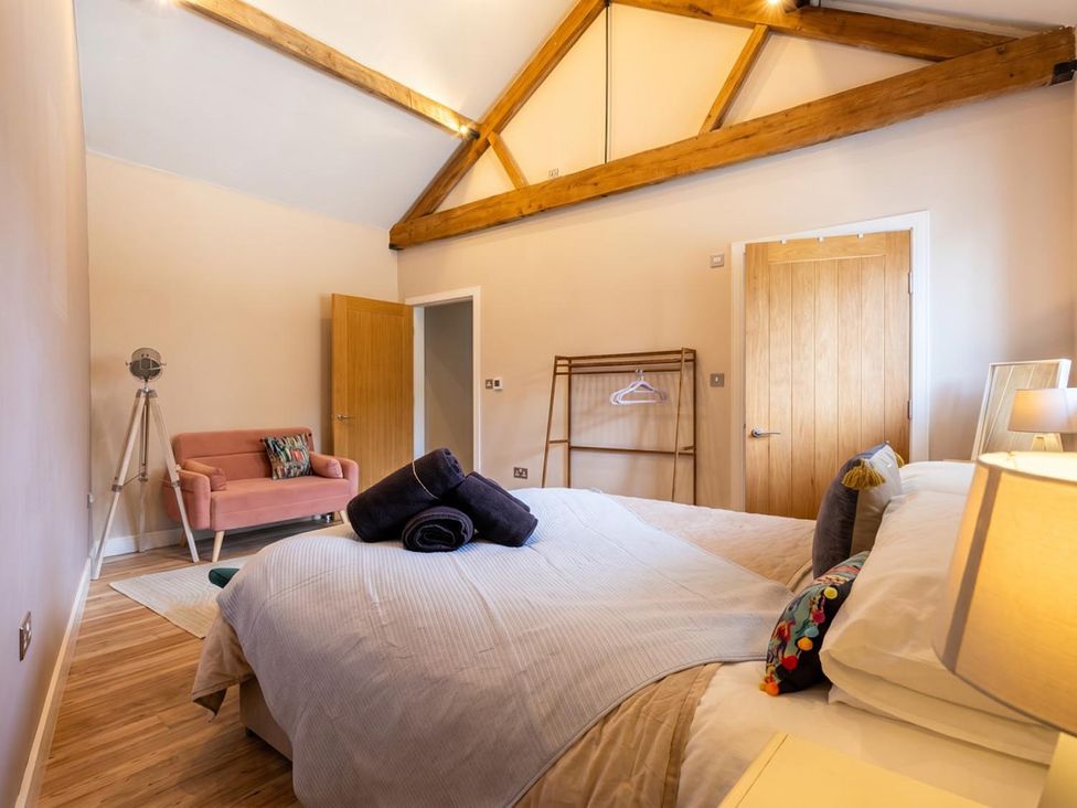 A bedroom with a bed and sofa at the property in location