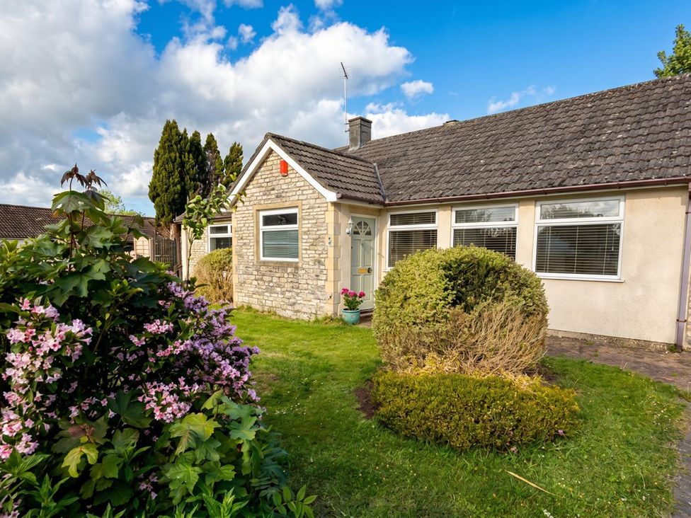 A house with garden and bushes at