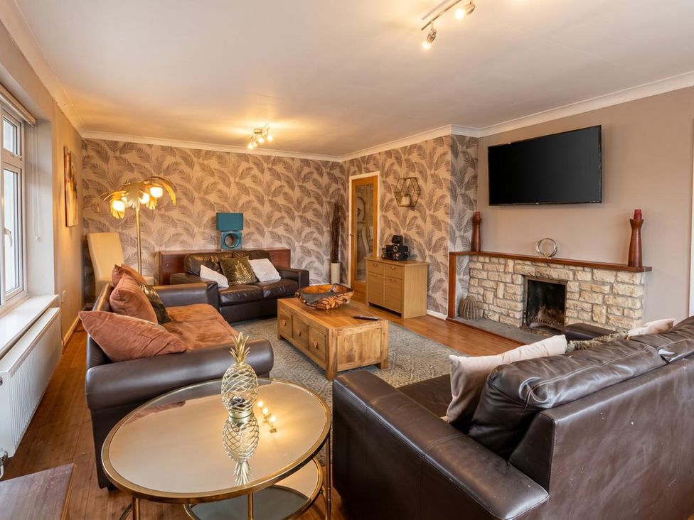 A living room with a sofa and coffee table at The Old Barn in Manchester