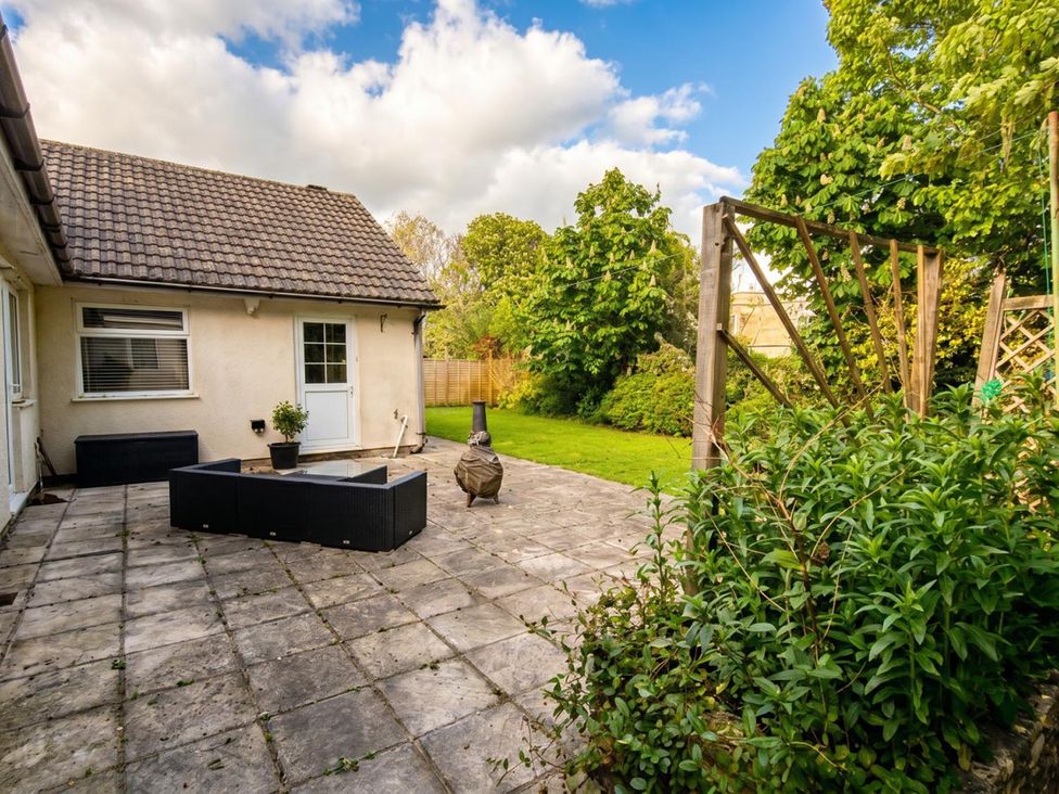 A garden with a patio and plants at the property in 