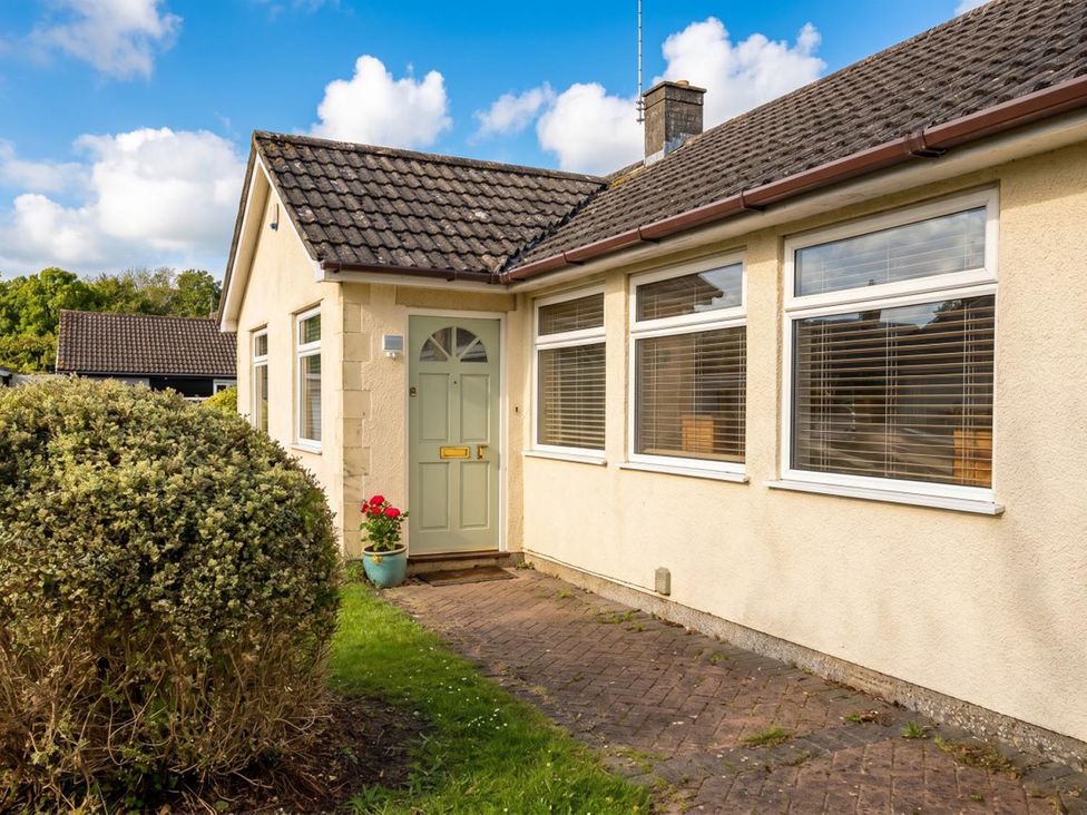 A house exterior with a front door and windows at a residential property