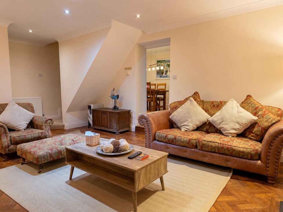 A living room with a sofa and coffee table at The Old Barn in Manchester