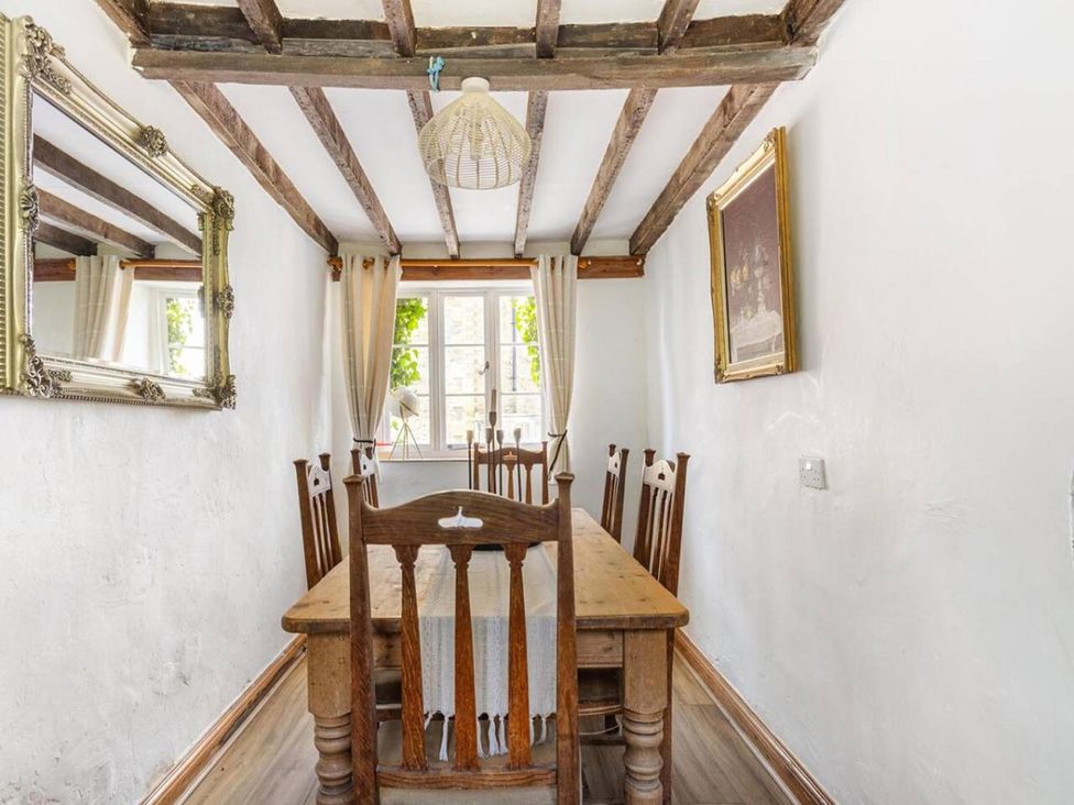 A dining room with a table and chairs at The Old Barn in Manchester