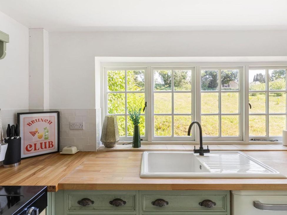 A kitchen with a sink and window at the property