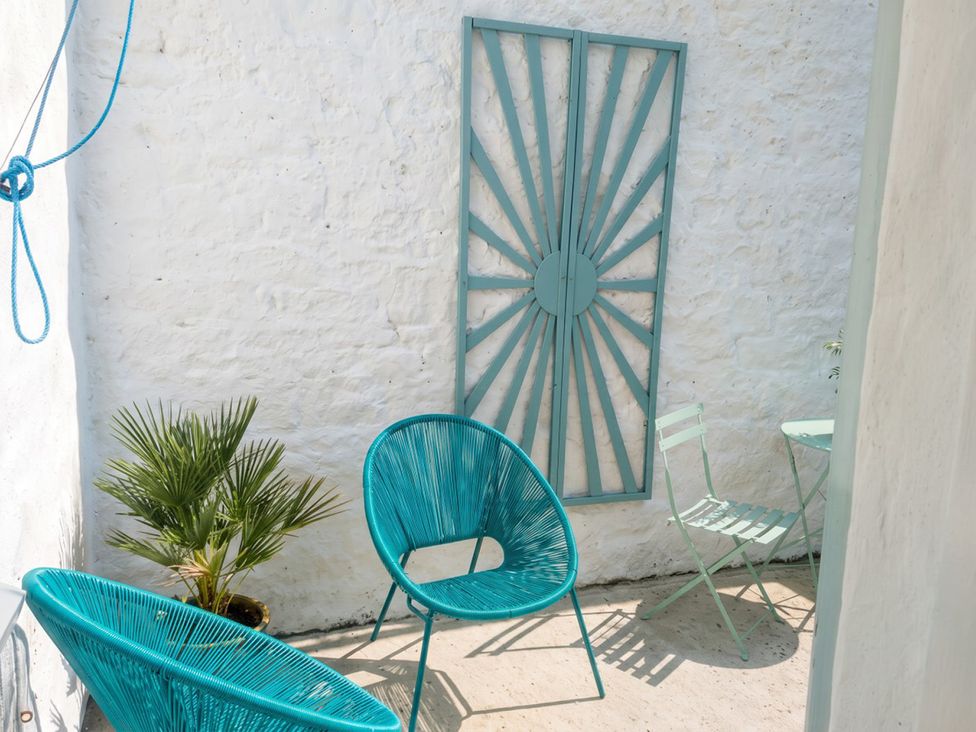 An outdoor seating area with chairs and a small table at the property