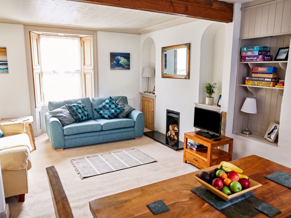 A living room with a sofa and coffee table at The Old Barn in Manchester