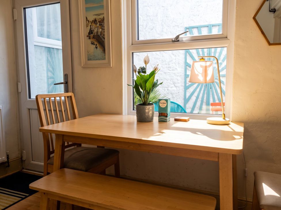 A dining room with a table and chairs at a property