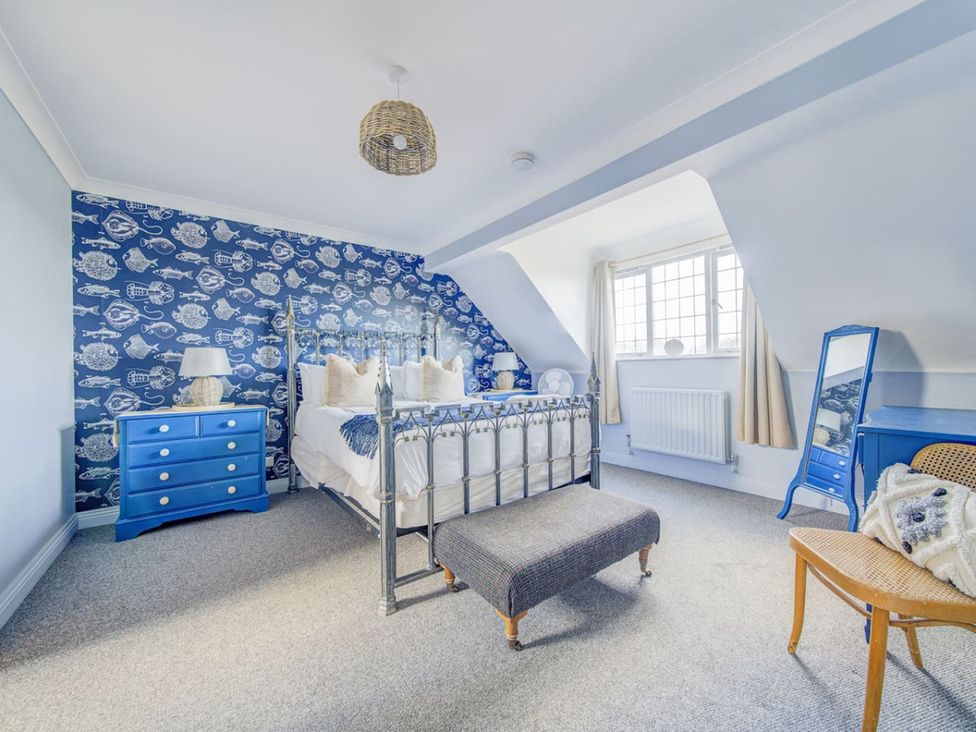 A bedroom with a bed and nightstand at the property in the location