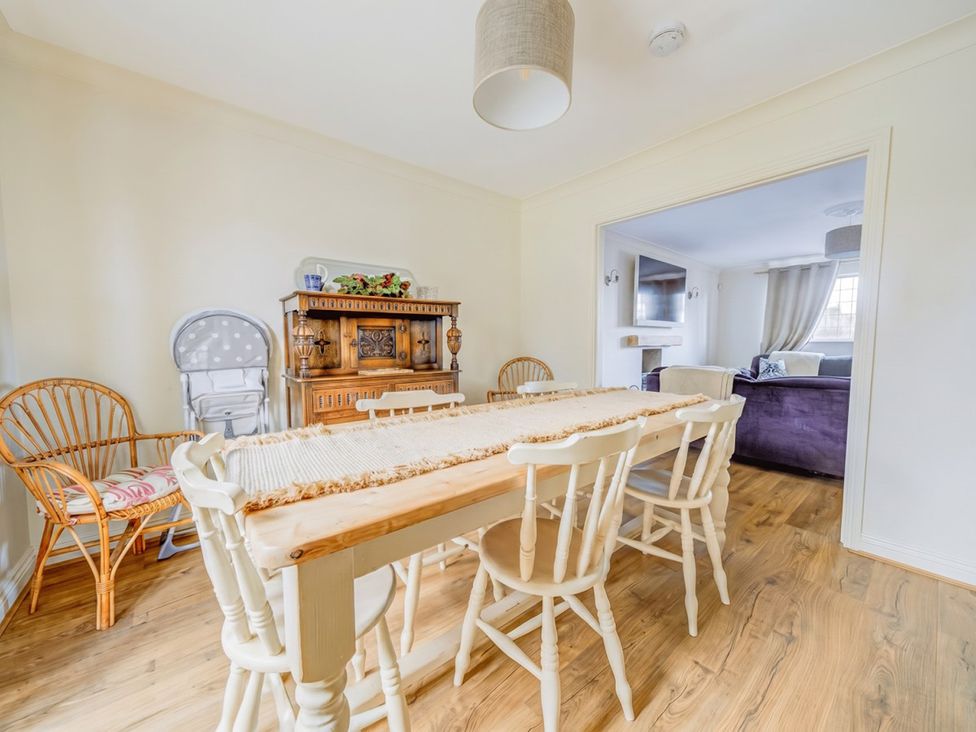 A dining room with a table and chairs at The Old Barn in Manchester