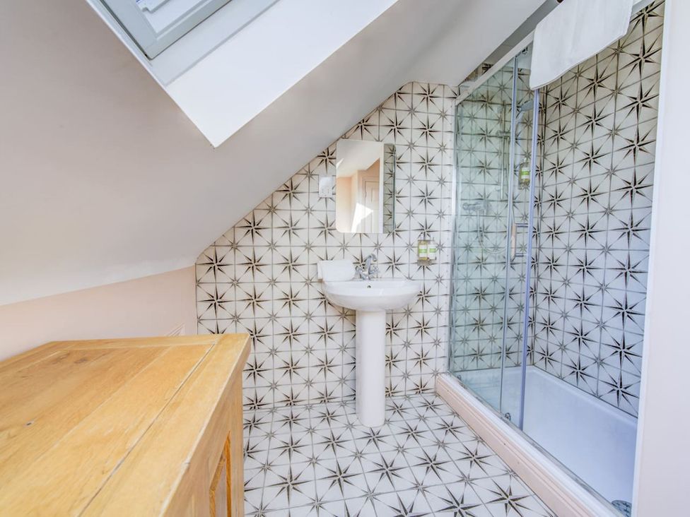 A bathroom with a sink and shower at The Old Barn in Manchester