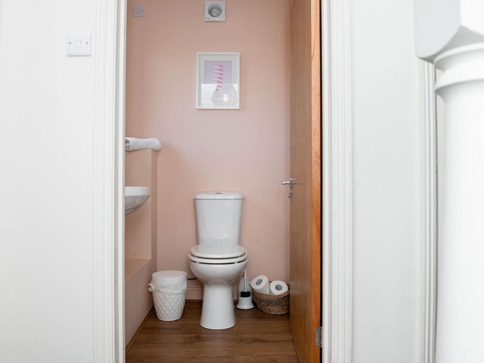 A bathroom with a toilet and sink at The Old Barn in Manchester