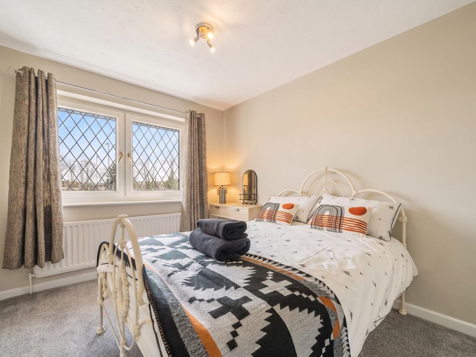 A bedroom with a bed and window at 