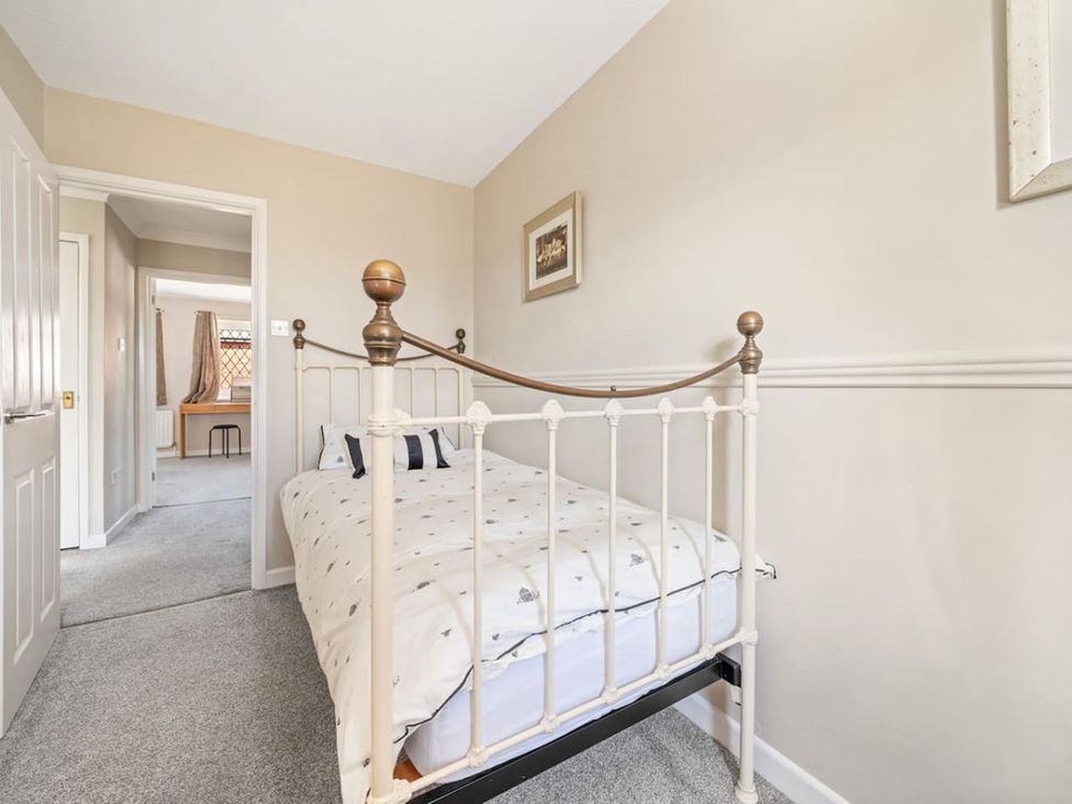 A bedroom with a bed and door at the property in unspecified location