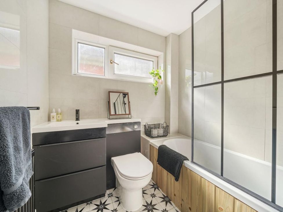 A bathroom with a sink and bathtub at The Old Barn in Manchester