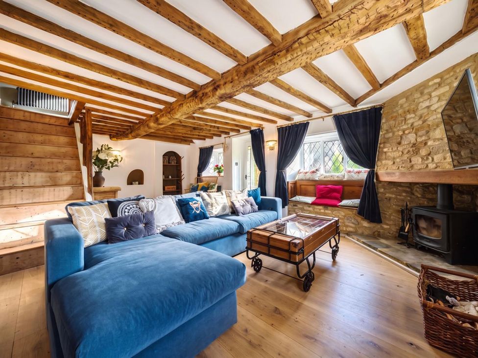 A living room with a sofa and coffee table at The Old Barn in Manchester