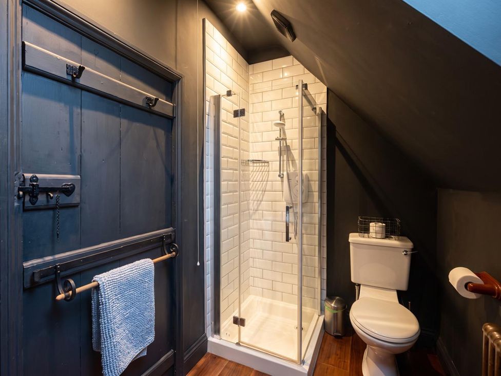 A bathroom with a shower and toilet at The Old Barn in Manchester