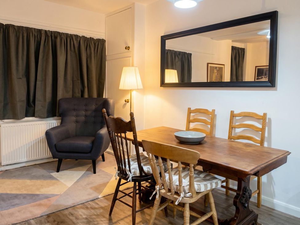A dining room with a table and chairs at The Old Barn in Manchester