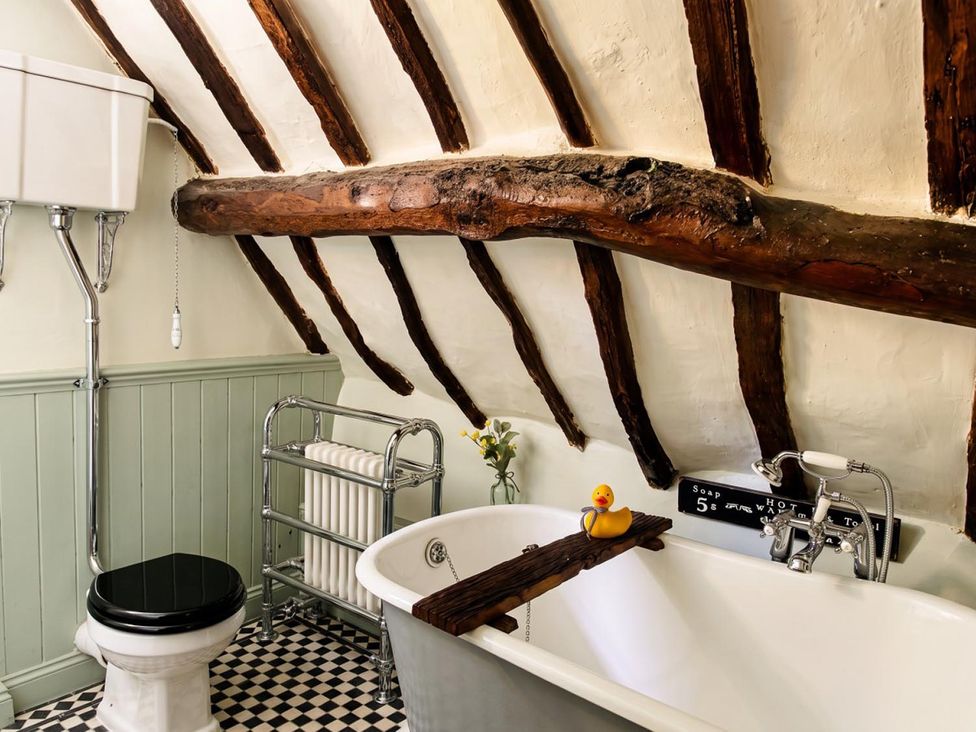A bathroom with a bathtub and toilet at 